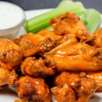 Big Red'S Famous Wings · Tossed in choice of sauce or our signature spicy dry rub.