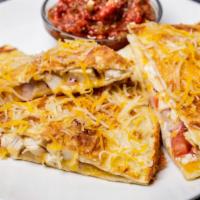 Chicken Quesadilla · Grilled chicken, cheddar jack cheese, tomatoes, and onions.