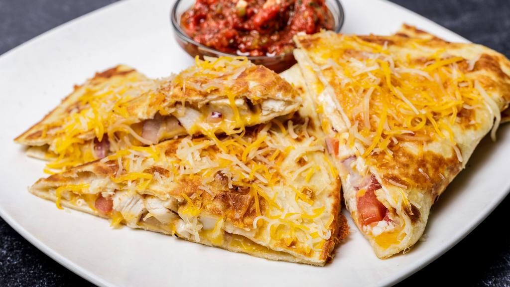 Chicken Quesadilla · Grilled chicken, cheddar jack cheese, tomatoes, and onions.