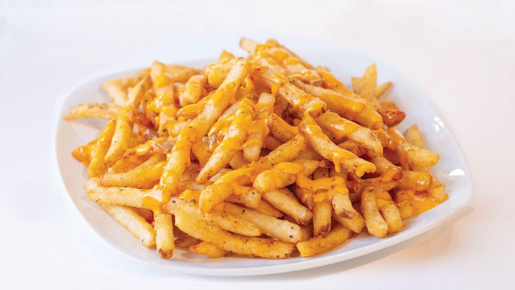 Famous Fries · Salt and pepper seasoned fries with our signature blend of seasoning and drizzled with Boom Boom sauce.