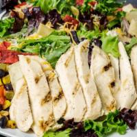 Southwest Chicken Salad · Grilled chicken breast, cheddar jack cheese, roasted black bean and corn salsa, topped with ...