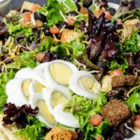 Dinner Salad · Cheddar jack cheese, tomatoes, black olives, croutons and a sliced egg.