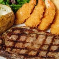 New York Strip Steak · 10 oz hand-cut, lightly seasoned, and charbroiled. Served with choice of two sides and a din...