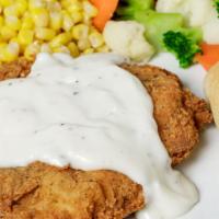 Hand Breaded Chicken Dinner · Boneless chicken breast, hand-breaded, pan-fried and smothered in gravy. Served with choice ...