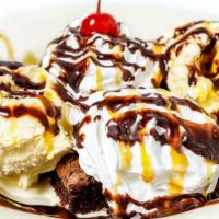 Brownie Sundae · Fudge brownie topped with ice cream, chocolate syrup, caramel, and whipped topping.