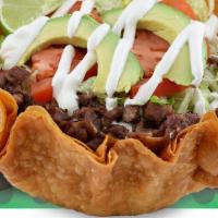 Taco Salad · Served with: meat of choice, beans, rice, sour cream, avocado, lettuce, tomato and cheese.