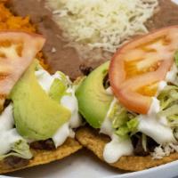 Tostadas Dinner · Two tostadas meat of choice served with beans, lettuce, tomato, sour cream, cheese, avocado....