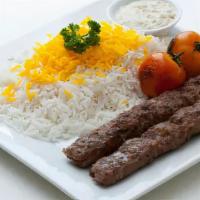 Shish Kebab · Two shish kebabs served with rice, grilled onion and tomato, mildly hot sauce.
