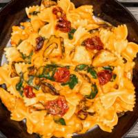 Farfalle · Chicken, shallots, mushrooms, roasted tomato, spinach, roasted red pepper cream sauce, fresh...
