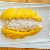 Mango & Sticky Rice · Fresh sliced mango, sticky rice with sweetened coconut milk frosting.