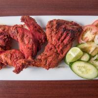 Chicken Tikka (3)  · Chicken leg quarters marinated in yogurt, South Asian herbs and spices, cooked over a slow c...