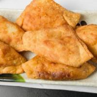 Crab Rangoon (6) 蟹角 · 6 pieces. Delicious cream cheese, onions, and imitation crab meat, nestled in a crab shaped ...