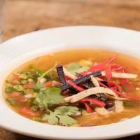 Chicken Tortilla Soup · Our from-scratch soup features tender chunks of chicken and vegetables simmered in a flavorf...