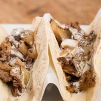 Street Tacos · Favorite. Three corn tortillas filled with grilled steak topped with cilantro and onions. Se...