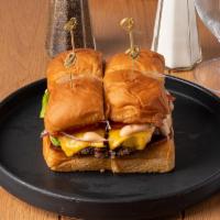 The Bumper Burger · American cheese, lettuce, tomato, onion, pickle, 1,000 island, mini Hawaiian buns.