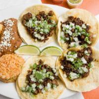 Taco Plate · Choice of four tacos, served with rice, pico de gallo and beans