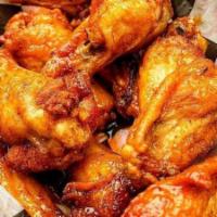 Wings - Boneless Or Bone In · House brined drummies and flats, or boneless served wet or dry-with celery and carrot sticks.