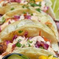 Tacos · 3 authentic southwest taco - served with chicken, lettuce, mango relish and our signature ta...