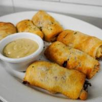 Reuben Rolls · Tender corned beef and tangy sauerkraut. rolled in pastry and baked golden. Served. with Eng...