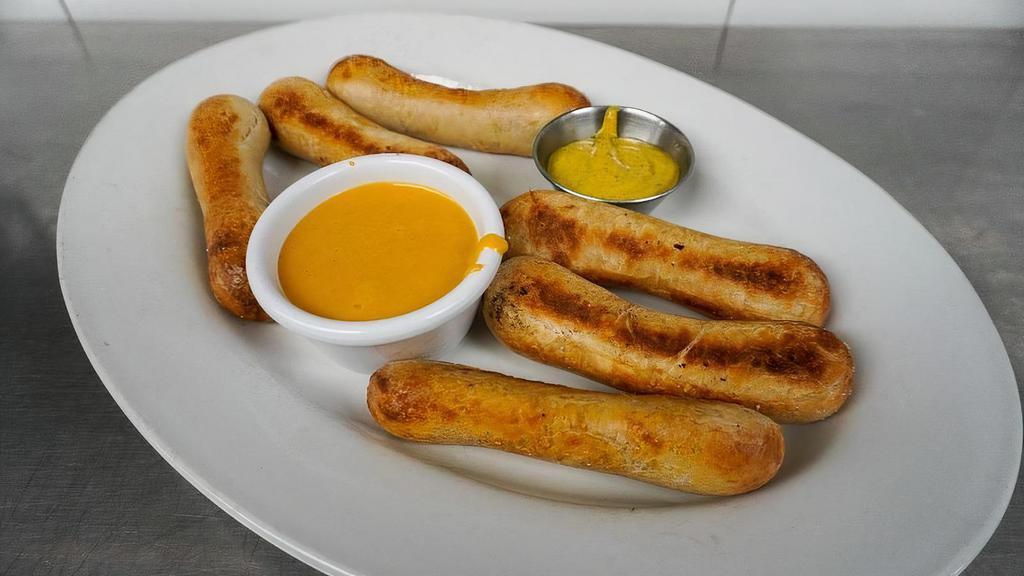 Pretzels · Six pretzel chubs served with cheddar sauce and German mustard.