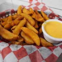 Cheddar Dip & Chips · Our house chips served with cheddar sauce on the side