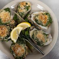Oysters Shamrockafeller · Fresh spinach, Parmesan, Pernod, bread. crumbs, and fresh oysters baked on the half. shell. ...