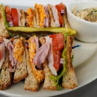 Celtic Club Sandwich · Turkey and ham, pimiento cheese, crispy bacon, lettuce, tomato and onion on toasted wheat br...