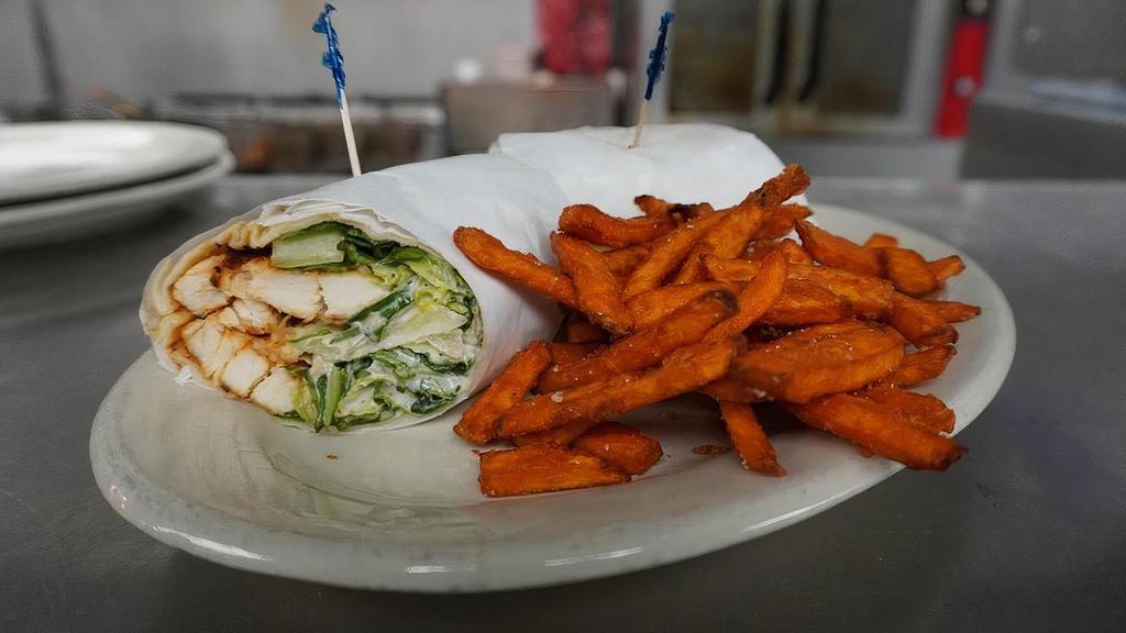 Kilkenny'S Wrap · Choose from our house, spinach, Caesar or curried chicken salad. Your choice of grilled or blackened chicken, salmon or shrimp and your choice of dressing. Wrapped in a flour tortilla.