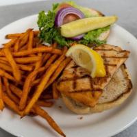 Salmon Sandwich · A 4 oz. filet of salmon grilled or fried, served on a grilled Kaiser roll with homemade tart...