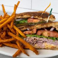 Ham And Pimiento Sandwich · Smoked deli ham topped with Pimiento cheese, lettuce, tomato, onion, on toasted wheat bread.