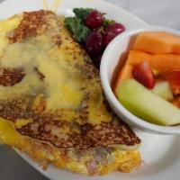 Break Boxty · An omelet of rashers, bangers, and Irish. cheddar inside a boxty topped with. Hollandaise sa...