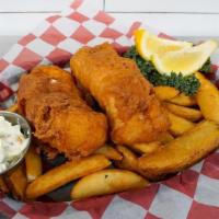 Fish And Chips · Beer-battered Icelandic Cod, fried golden brown and served with crisp potato wedges and tang...