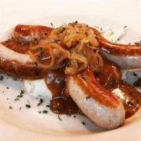 Bangers And Mash · Four Irish sausages (bangers) served with. a generous portion of champ, topped with. caramel...