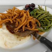 Meatloaf Dinner (Regular) · A serious slice of home-made meatloaf rested on creamy mashed potatoes topped with our Guinn...