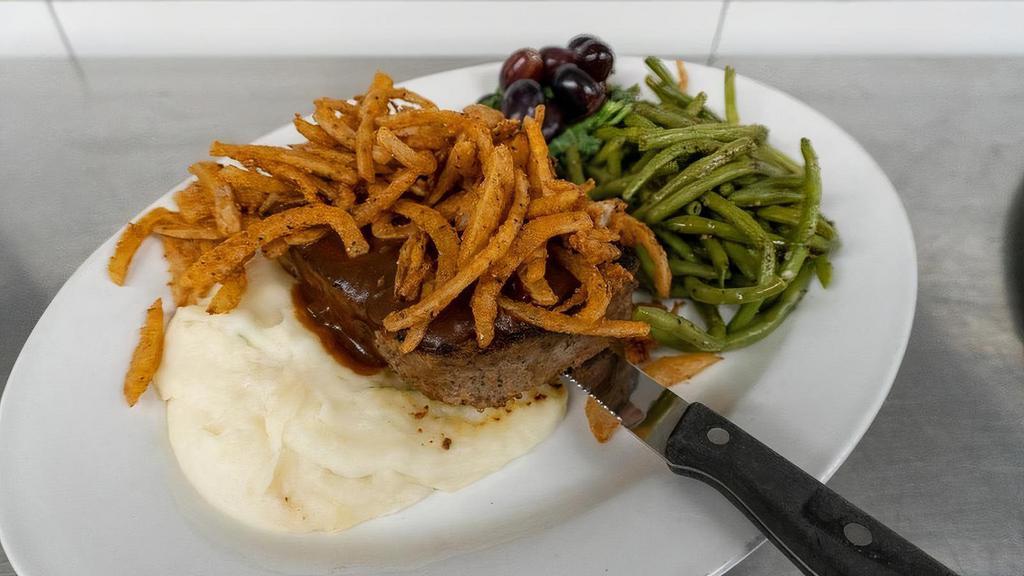 Meatloaf Dinner (Regular) · A serious slice of home-made meatloaf rested on creamy mashed potatoes topped with our Guinness gravy and crispy fried onion strings. Served with green beans.