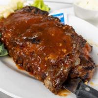 Ribs Full · Tender, fall-off-the-bone baby back ribs smothered in Guinness BBQ sauce