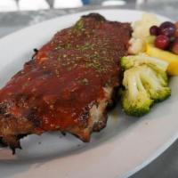 Ribs Half · A half rack of tender, fall-off-the-bone baby back ribs smothered in Guinness BBQ sauce