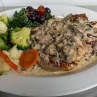 Pork Chop · A 12oz. pork rib chop, butterflied and grilled. Topped with Kilkenny’s apple mushroom sauce,...