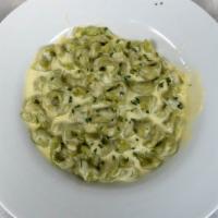 Lunch Tortellini · Half moon shaped spinach pasta filled with a creamy blend of cheeses, “Ravioli style” tossed...
