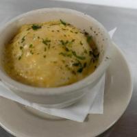 Side Potatoes O' Gratin · A creamy blend of sliced potatoes and Irish cheddar baked to perfection.