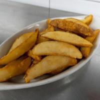 Side Irish Chips · Thick potato wedges fried crisp and golden.
