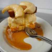 Bananas O' Foster · Vanilla ice cream between pound cake topped with flambeed banana halves and buttery, sugared...