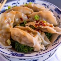 Spicy Dumpling (8)  红油水饺 · Steamed dumplings with ground pork and vegetable filling tossed in chef's spicy sauce. Serve...