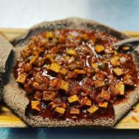 Specialty Tofu · Vegan. Tofu stewed in vegan butter, onions, and spices (hot stews served on injera).