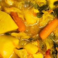 Curried Vegetable Medley (Atakilt Alicha) · Vegan. Freshly chopped cabbage, carrots, green beans, and potato chunks stewed in vegan butt...