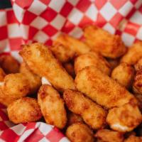 Cheese Curds · Real Wisconsin white Cheddar cheese curds dipped in beer batter then deep fried.