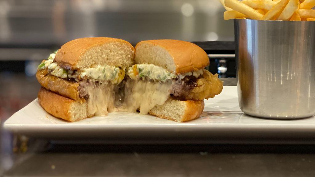 Double Award Winning Jalapeño Popper · Mild spice. Stuffed with jalapeños and pepper jack cheese, then breaded and deep-fried, topped with jalapeño cream cheese, and our signature jam. Served on a toasted bun.