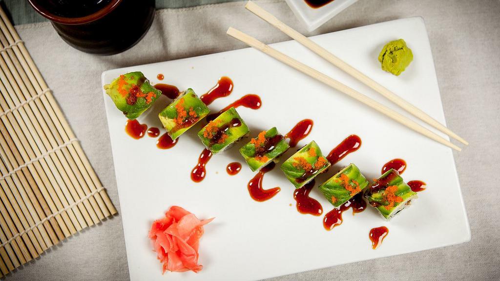 Dragon Roll · Eel and cucumber wrapped with avocado and topped with caviar.