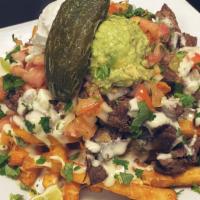 Carne Asada Fries · House fries topped with mixed cheese, pico, steak asada, queso, sour cream, guac, and jalape...