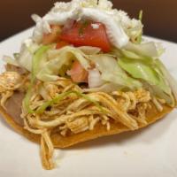 Tostadas (2) · Choice of shredded chicken, beef, pork, with refried beans, caggabe slaw, sour cream, and qu...